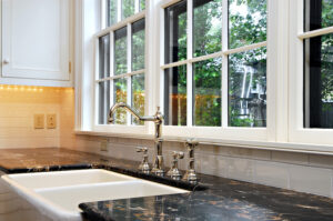 kitchen sink in front of a large window